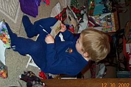 DCP_2326-Tyler-book reading on mini-chair.JPG